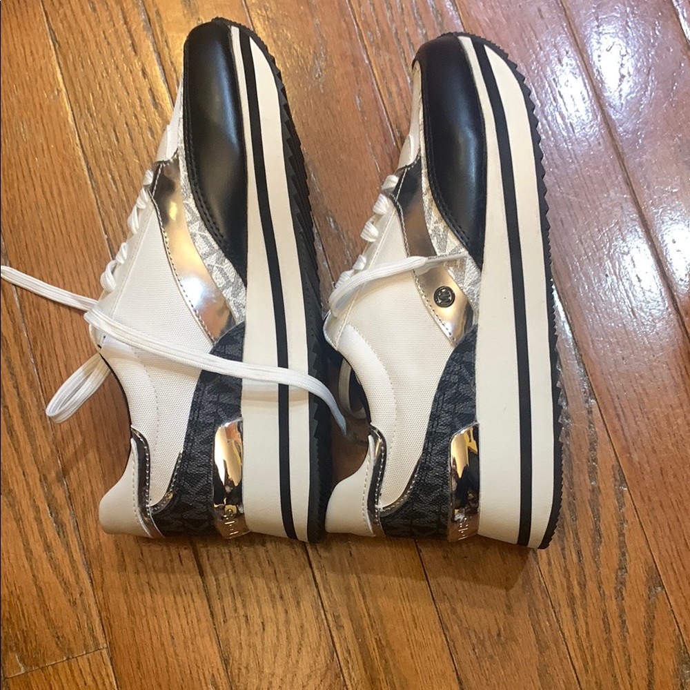 Stylish Black and White Sneakers with Silver Accents